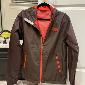 Brown and red North Face Windbreaker